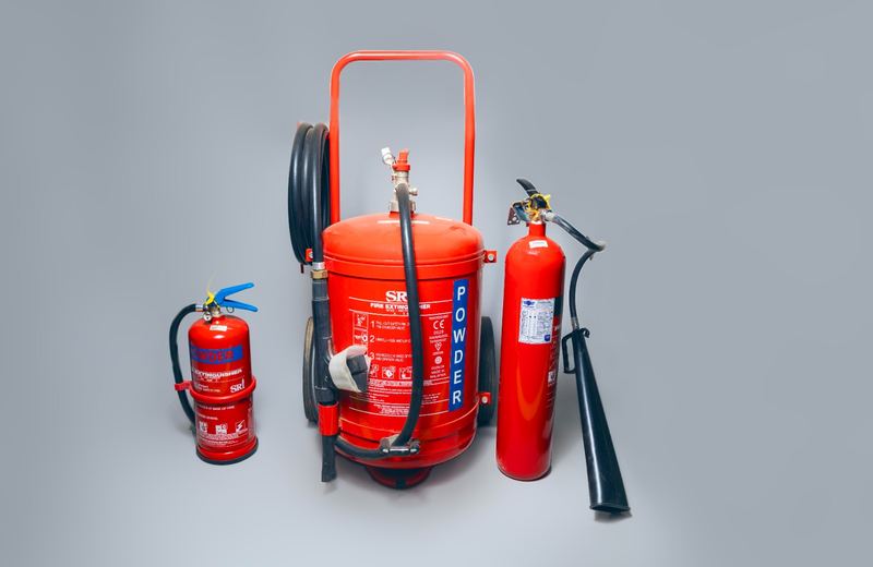 Fire extinguishers lined up at a facility